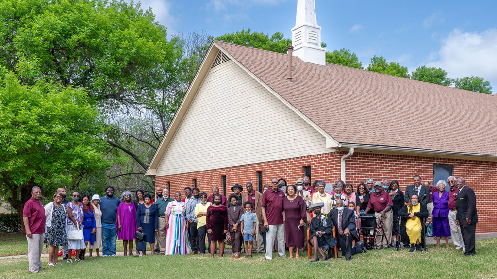 Mt. Carmel congregation standing in front of the church building